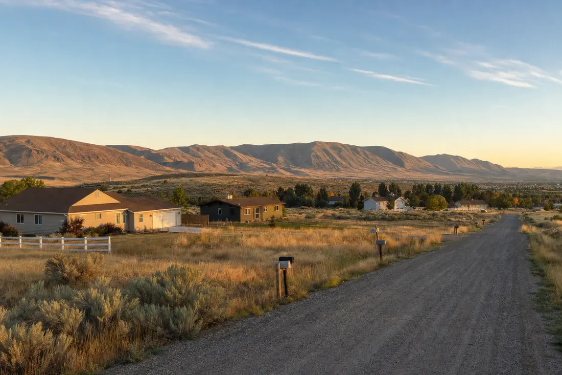 Gravel bench road with acreage homes and sagebrush at the edge of Pocatello, Idaho